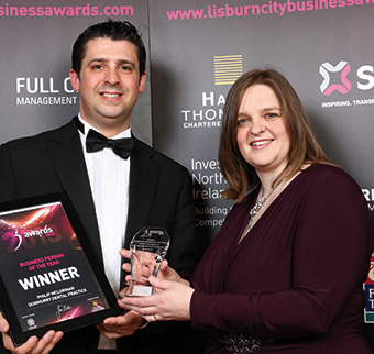 Philip received the award from Susan Dunlop of Hanna Thompson Chartered Accountants
