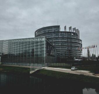 An exterior photo of the European Parliament building in Brussels.