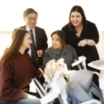 School students Alexandra Fabian, of Colaiste Pobail Setanta College, and Sofia el Hafidi, of the International School Michel Lucius, with Professor Albert Leung and Senior Lecturer Isabel Olegário at RCSI’s Transition Year Mini Health Sciences event